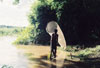 village man fishing with a net